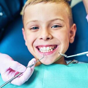 A young kid receives a dental exam