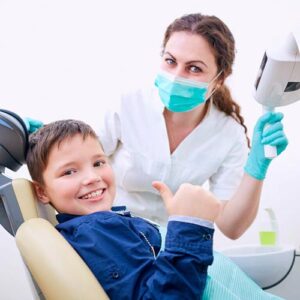 A young dental patient with a dentist