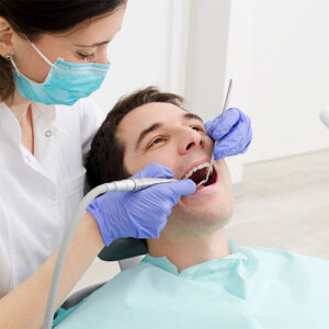 A periodontal patient gets a professional teeth cleaning